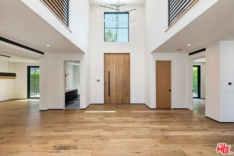 a view of livingroom with hardwood floor and hallway