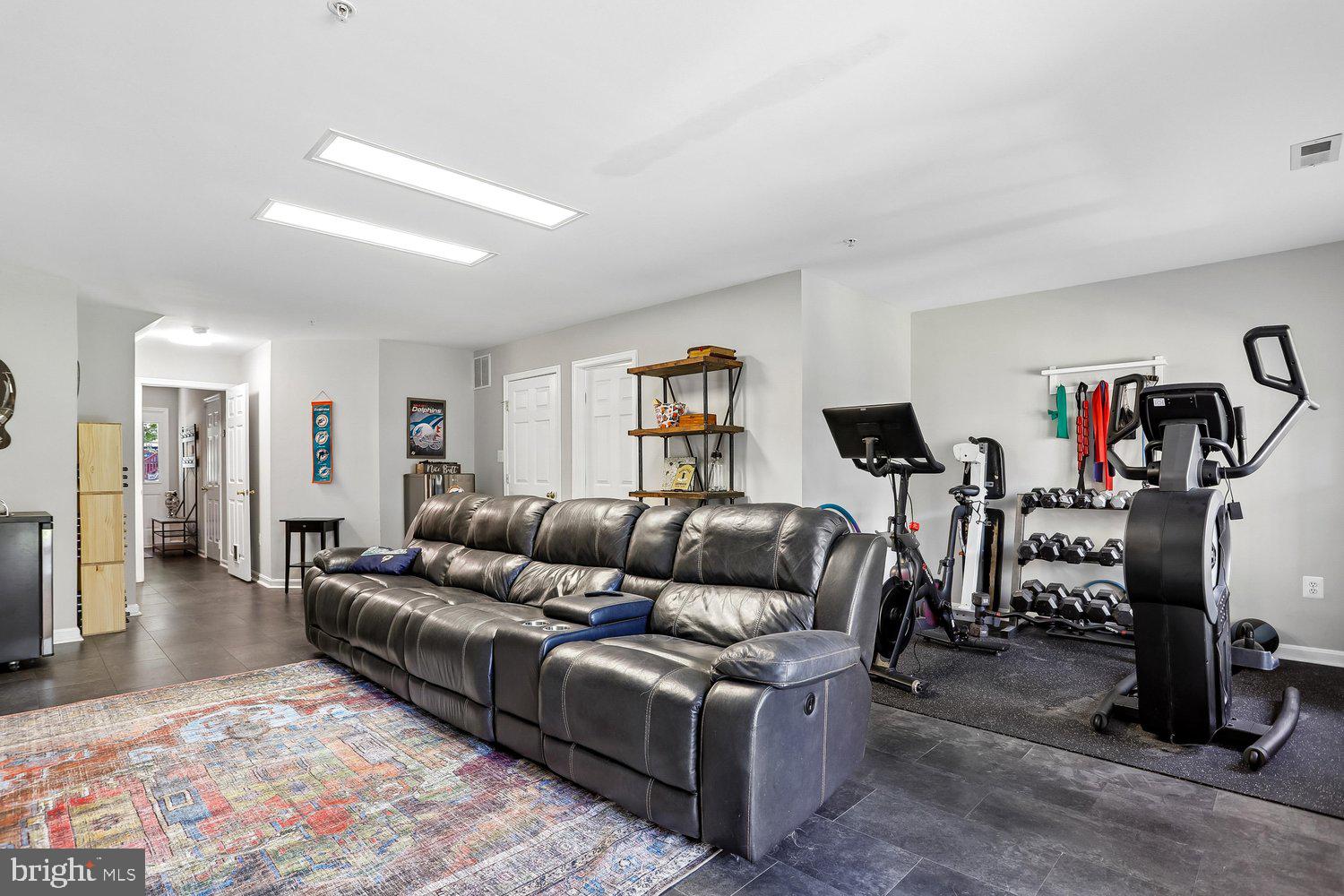 2530 Carrington Way Frederick, MD 21702 - Photo 28 of 38 a living room with furniture and gym equipment