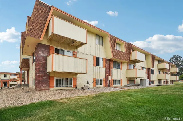 a view of a building with a yard