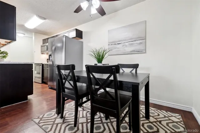 a view of a dining room with furniture and wooden floor