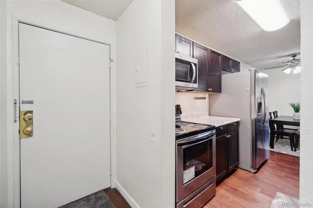 a kitchen with stainless steel appliances a stove and a refrigerator