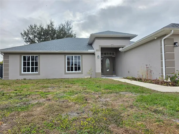 front view of a house with a yard