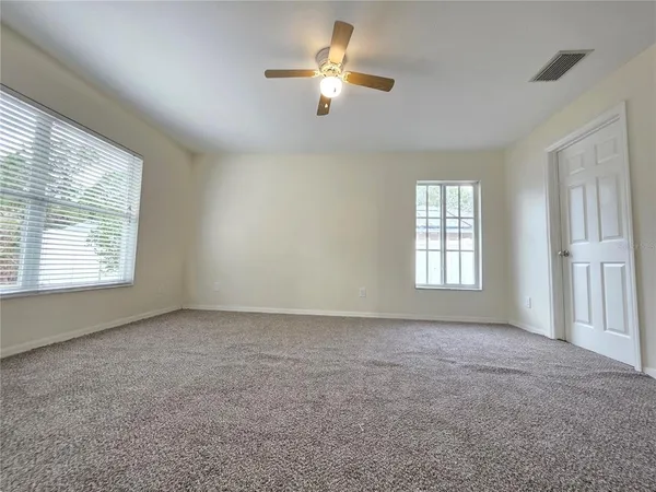 a view of an empty room with a window