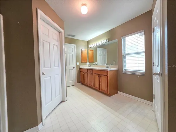 a view of a kitchen with a sink and a window