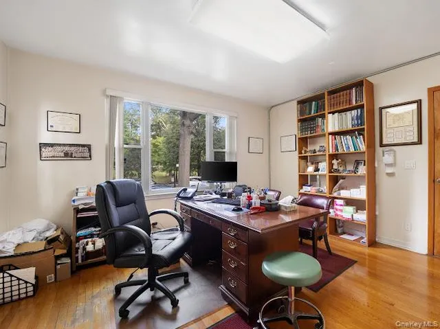 a work room with furniture and wooden floor