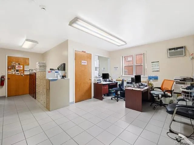 a view of a livingroom with furniture and a window