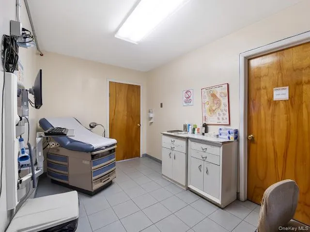 a room with furniture and a flat screen tv