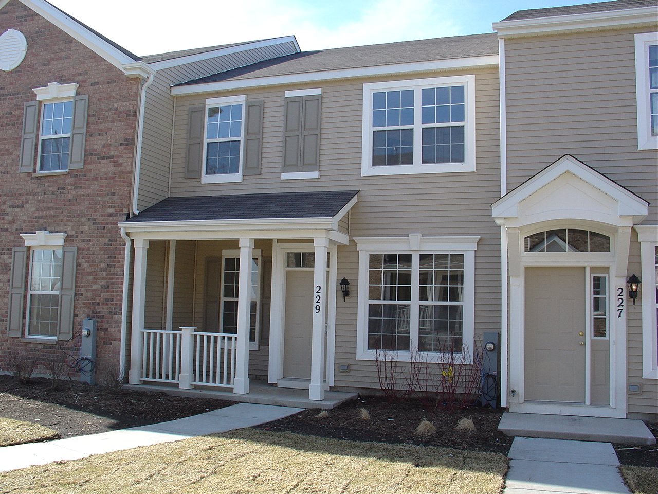 229 Springbrook Trail South Oswego, IL 60543 - Photo 1 of 10 a front view of a house with a porch