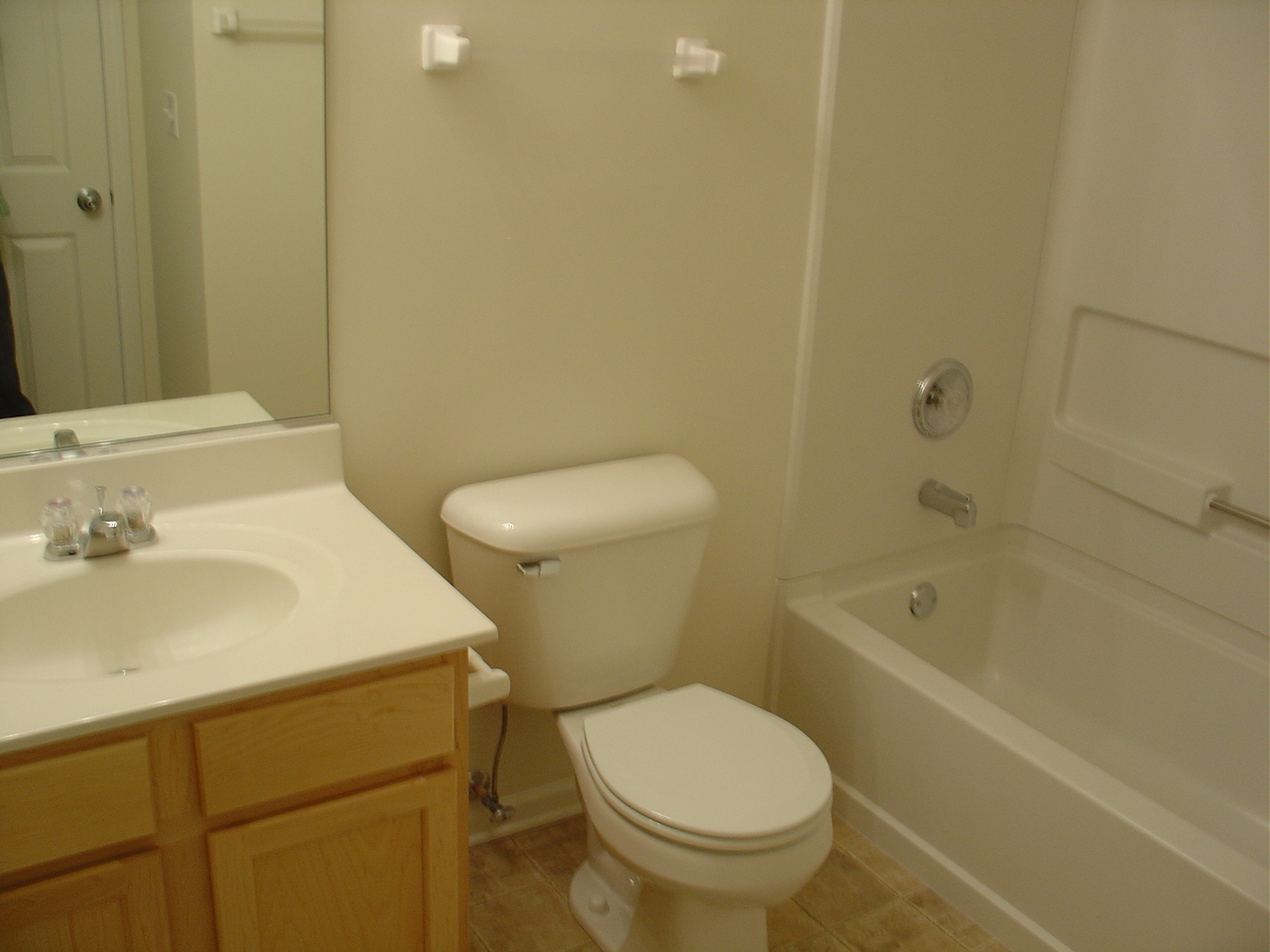 229 Springbrook Trail South Oswego, IL 60543 - Photo 8 of 10 a bathroom with a sink a toilet and shower