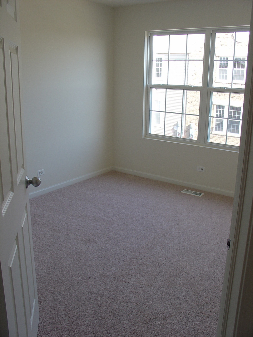 229 Springbrook Trail South Oswego, IL 60543 - Photo 10 of 10 an empty room with a window