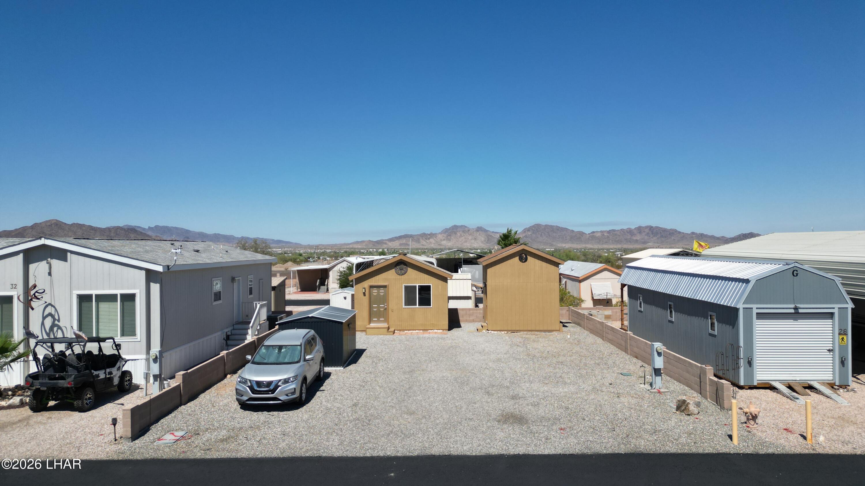 30 North Juniper Road Quartzsite, AZ 85346 - Photo 1 of 26 a view of a white house with many windows