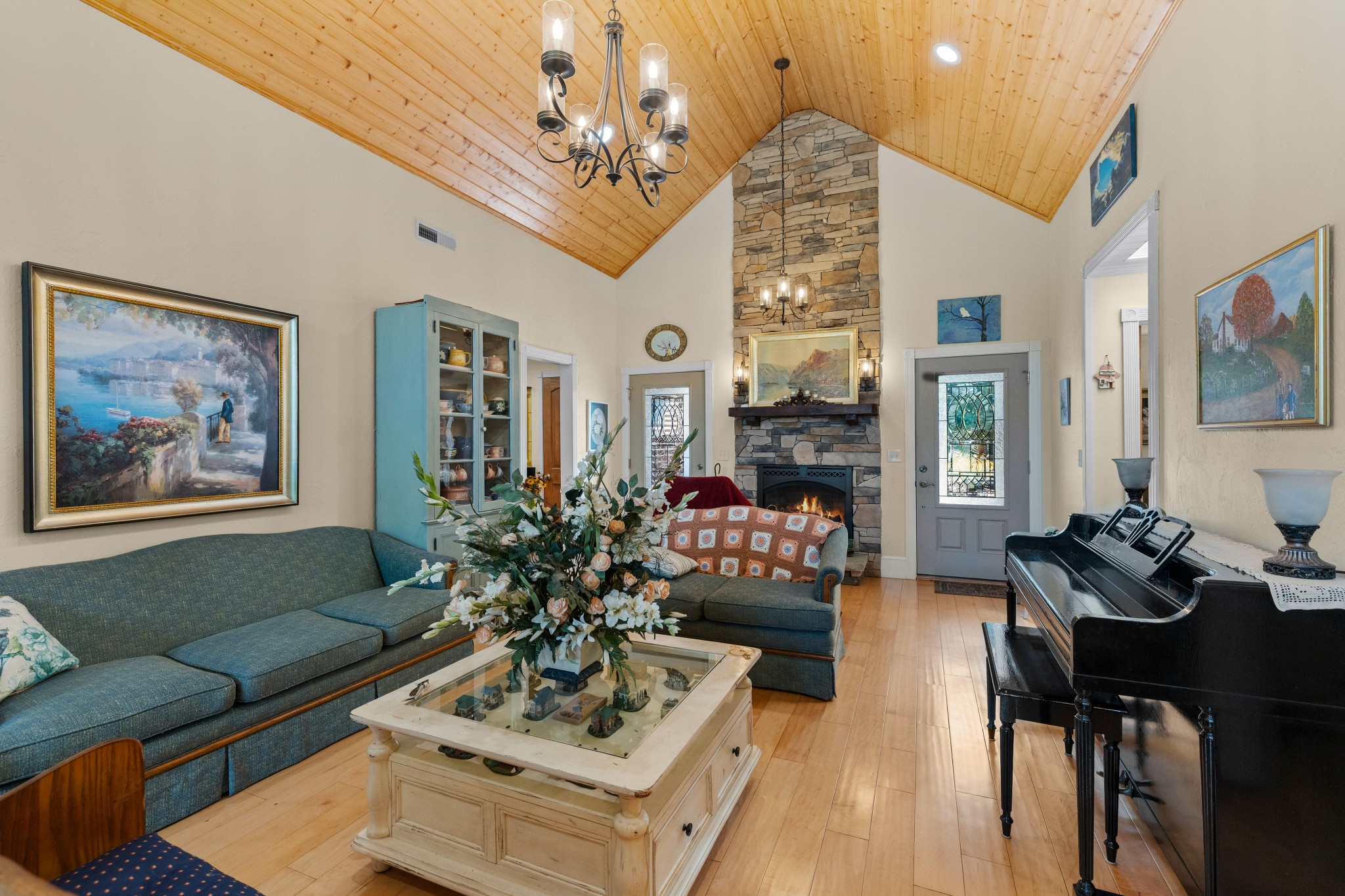 1556 Chestnut Grove Road Morrison, TN 37357 - Photo 9 of 58 a living room with furniture a chandelier and a fireplace