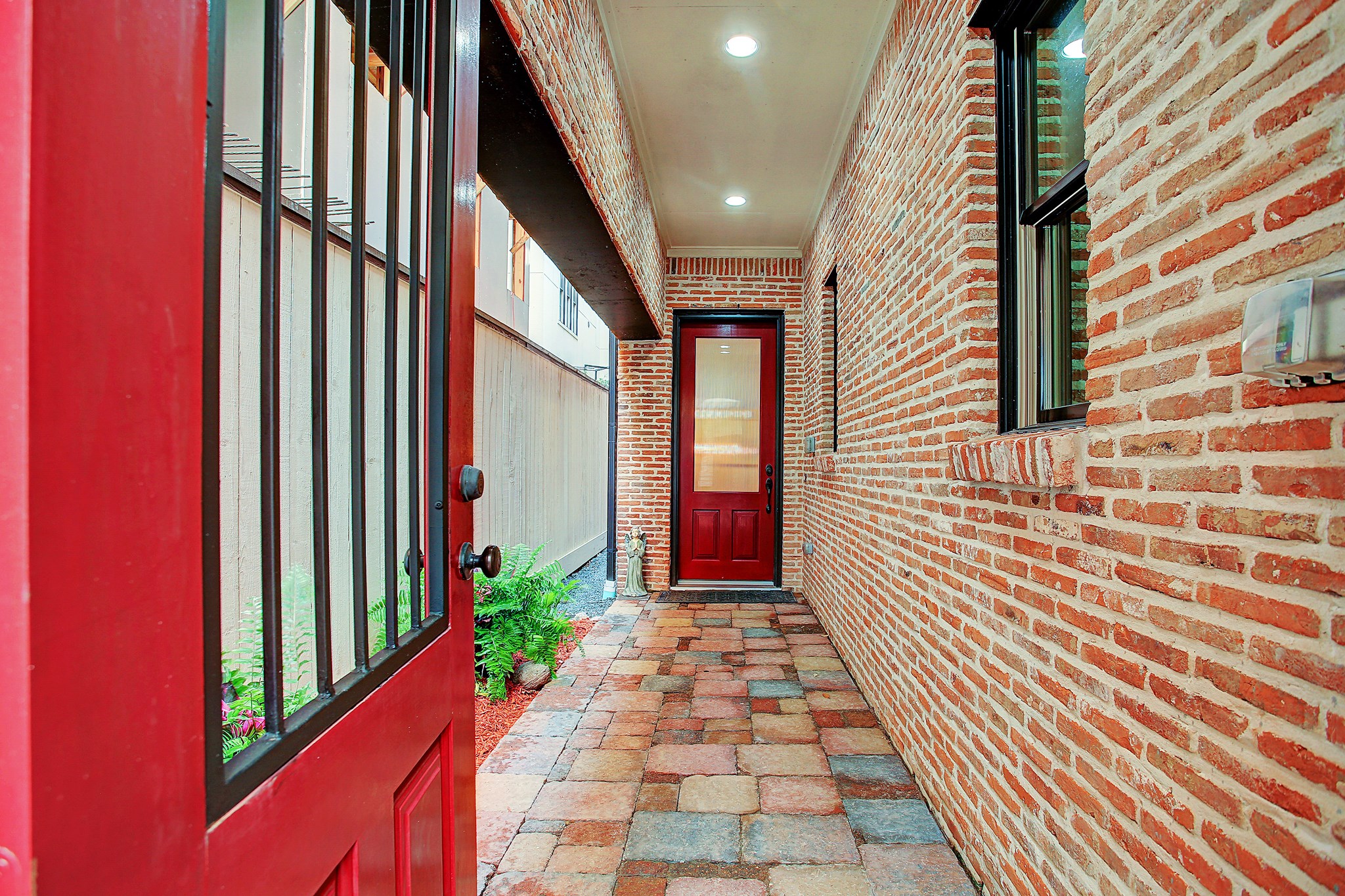 1307 Rosedale Street Houston, TX 77004 - Photo 4 of 32 a view of a pathway along with potted plants