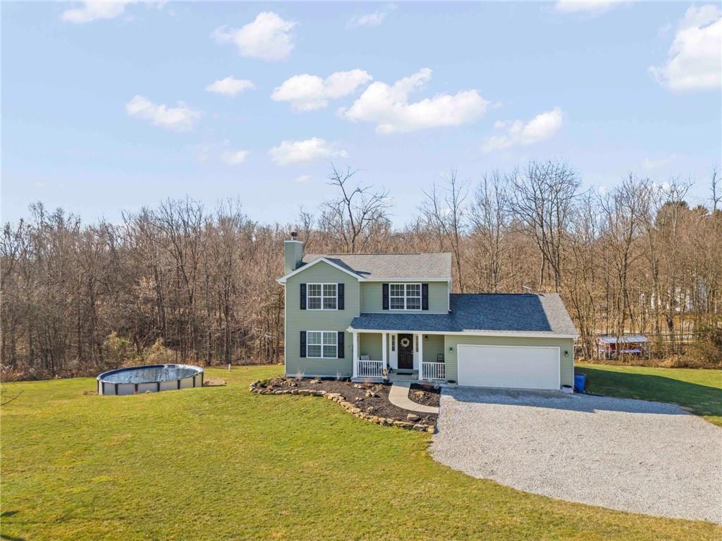 260 East Riverside Road East Millsboro, PA 15433 - Photo 11 of 40 Enjoying outside will be a breeze with low maintenance landscaping that includes spring and fall plantings.