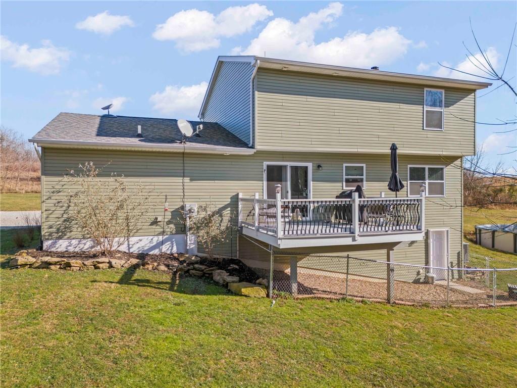 260 East Riverside Road East Millsboro, PA 15433 - Photo 21 of 40 Newly painted deck just outside the kitchen and a dog pen below so everyone can grab some sunshine