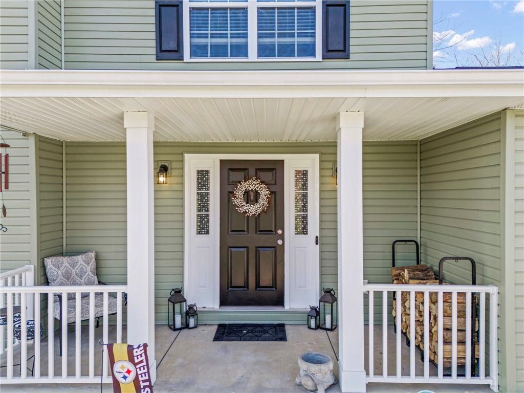 Welcome home to a wonderful covered porch and come inside to...