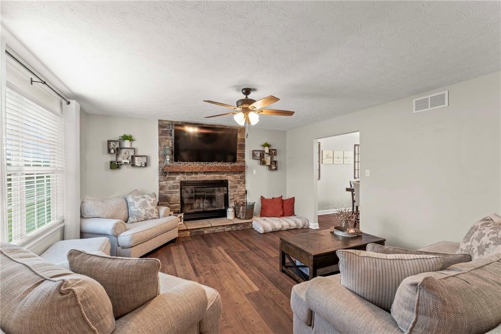 Expansive Living Room with wood burning fireplace to keep you warm in the winter.