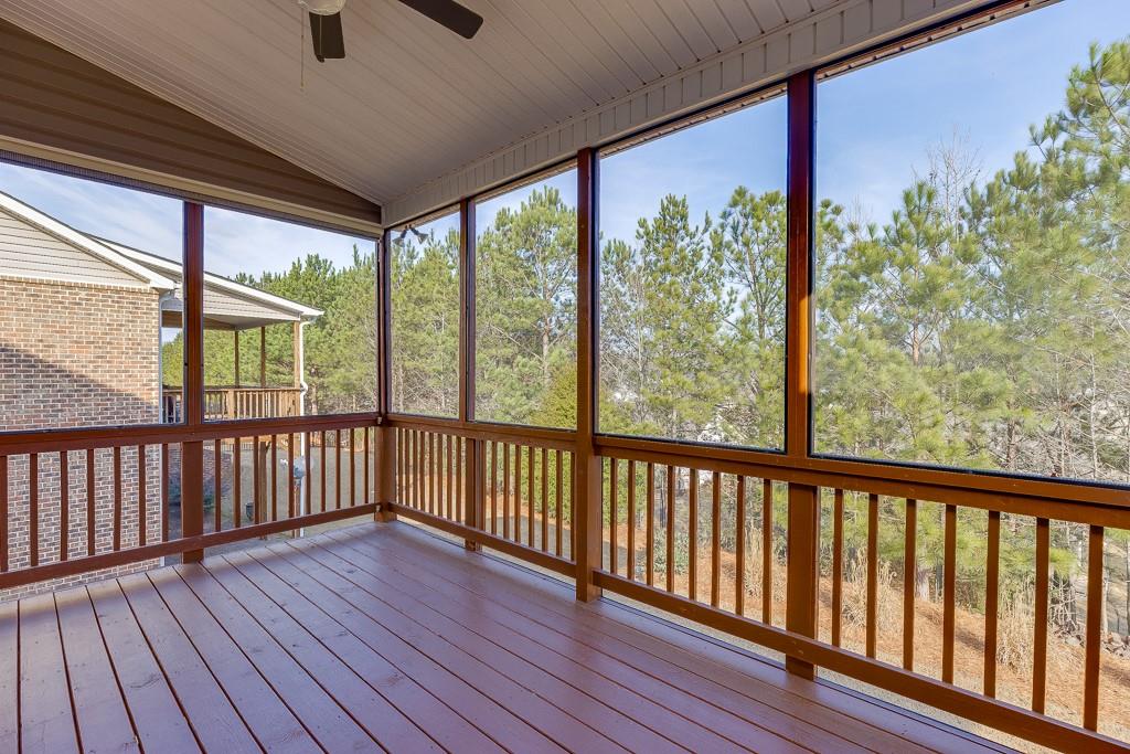 567 Lillian Way Jefferson, GA 30549 - Photo 20 of 80 a view of a porch with wooden floor and outdoor space
