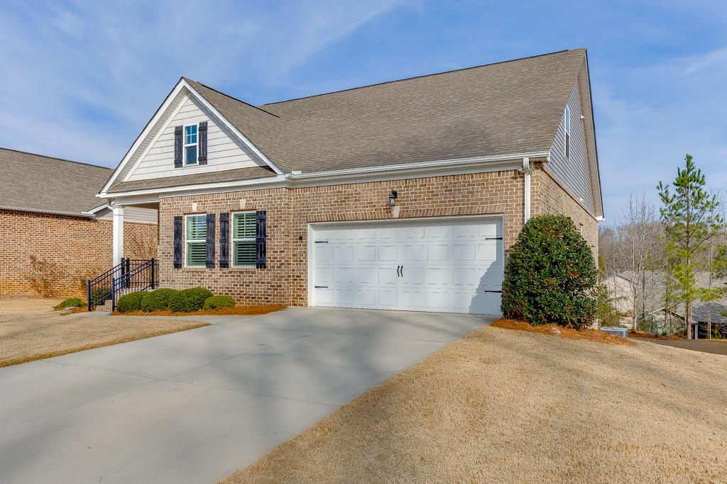 567 Lillian Way Jefferson, GA 30549 - Photo 3 of 80 a front view of a house with a yard and garage