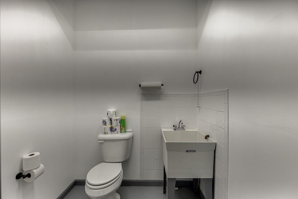 567 Lillian Way Jefferson, GA 30549 - Photo 48 of 80 a bathroom with a sink a toilet and a mirror