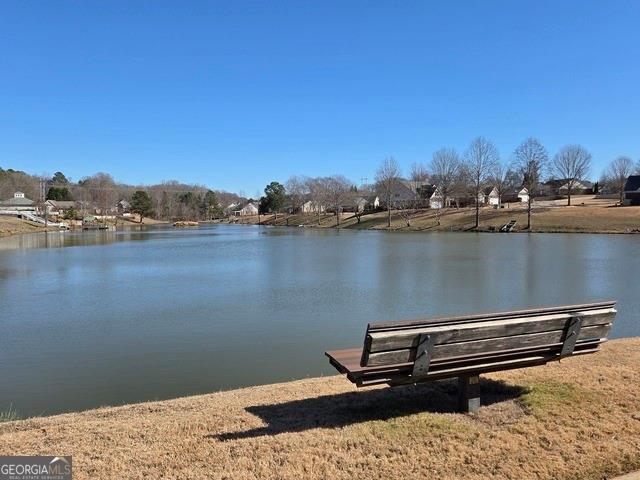 567 Lillian Way Jefferson, GA 30549 - Photo 59 of 80 a view of a terrace with wooden floor and lake view