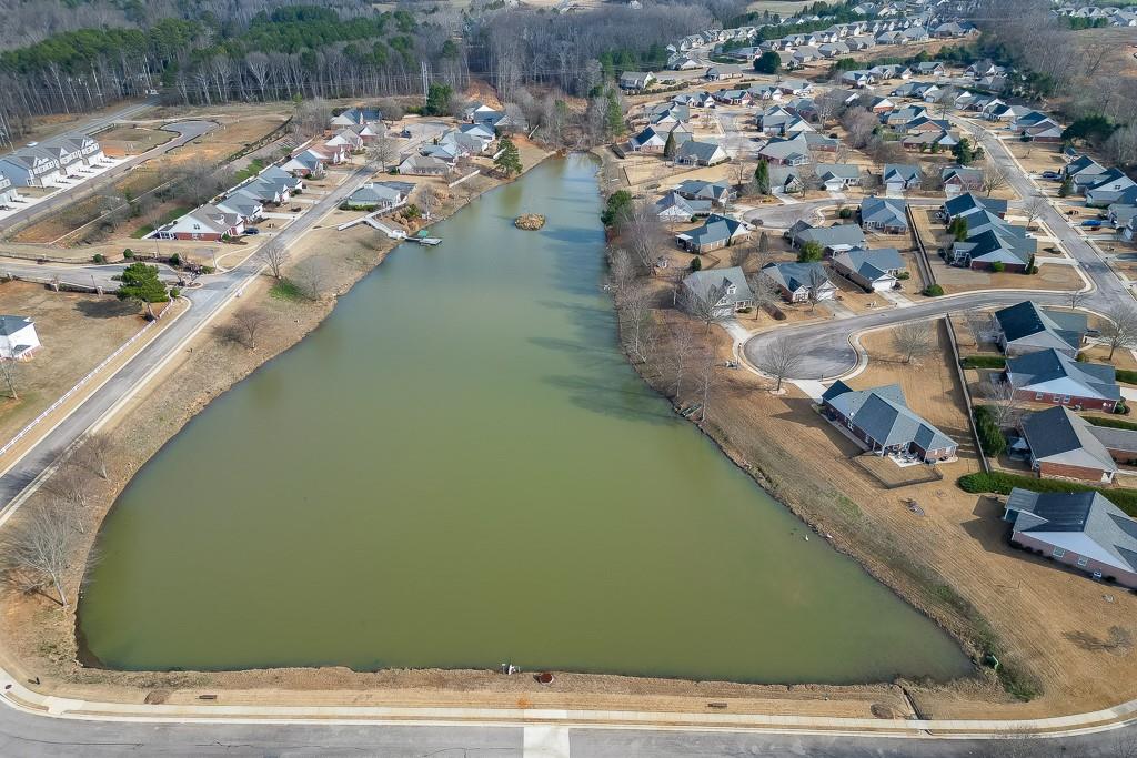 567 Lillian Way Jefferson, GA 30549 - Photo 65 of 80 an aerial view of a house with a yard and lake view