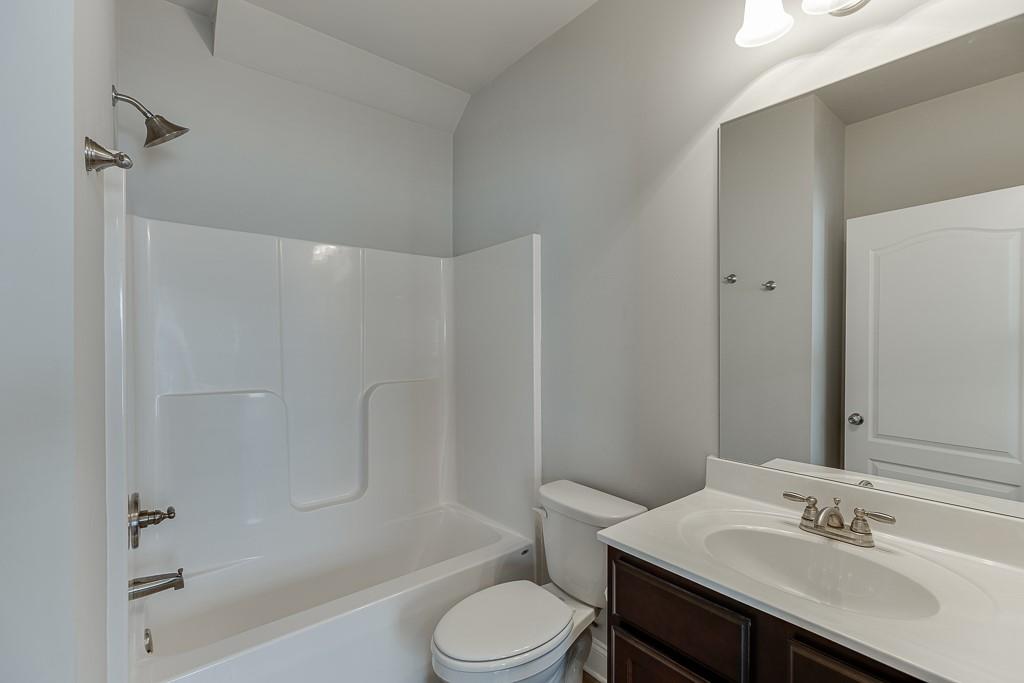 567 Lillian Way Jefferson, GA 30549 - Photo 10 of 80 a bathroom with a sink toilet tub and shower