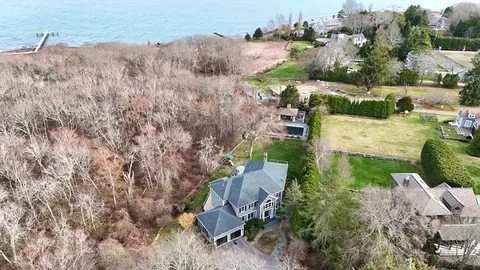 an aerial view of a house with outdoor space