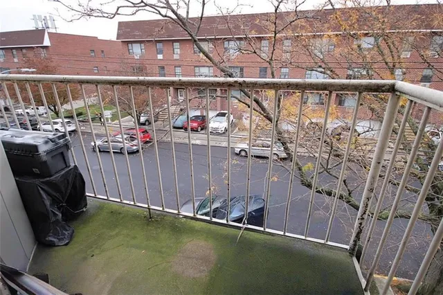 a view of a balcony with chairs