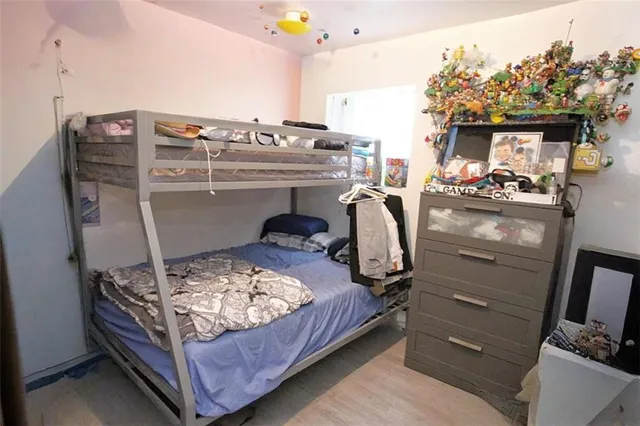 a bedroom with a bed and furniture