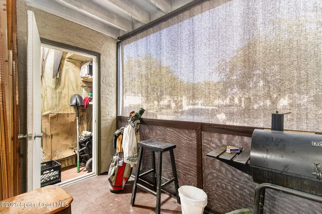 a view of a livingroom with furniture and windows