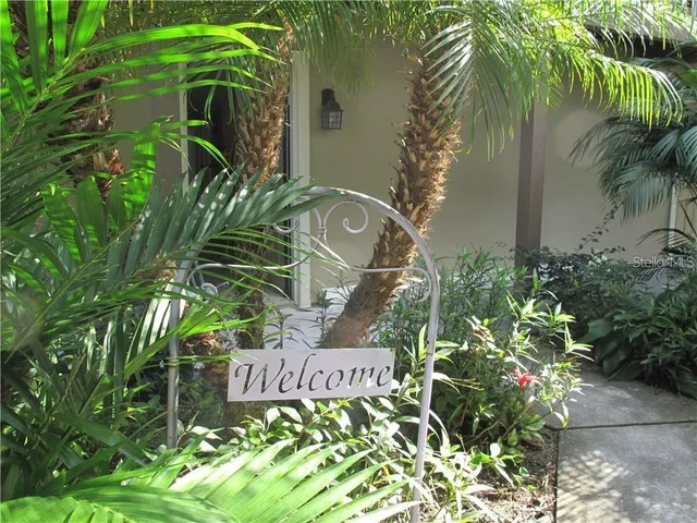 a sign that is sitting in front of a house