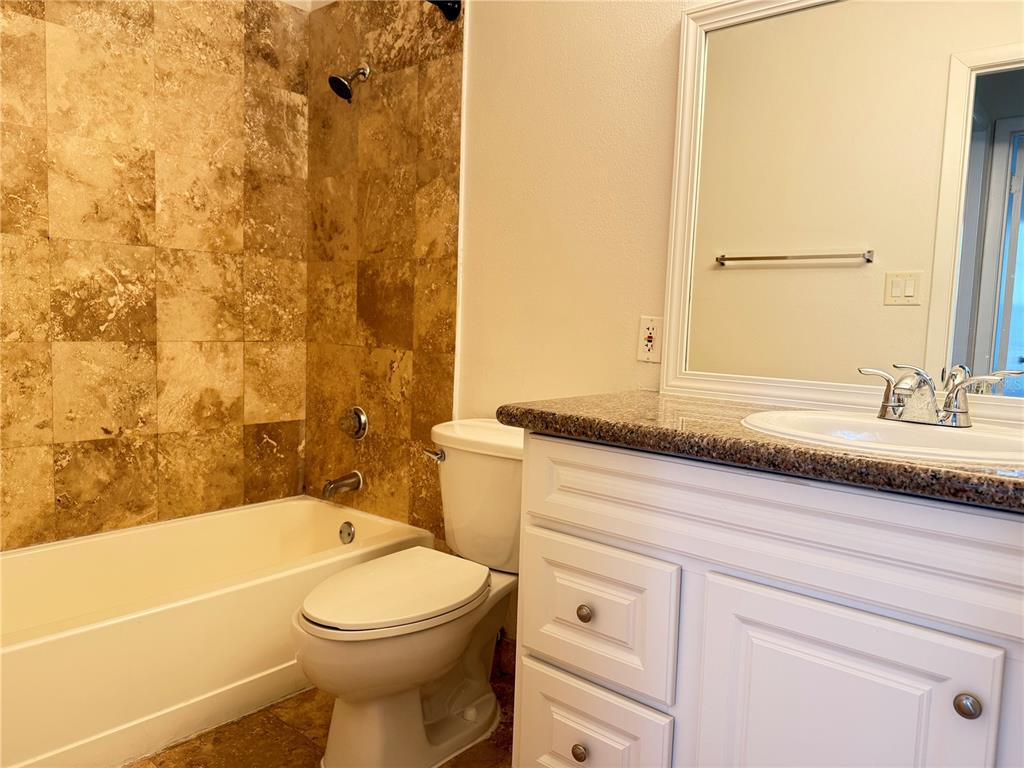 216 Afton Square, Unit 111 Altamonte Springs, FL 32714 - Photo 16 of 41 a bathroom with a sink a toilet and shower