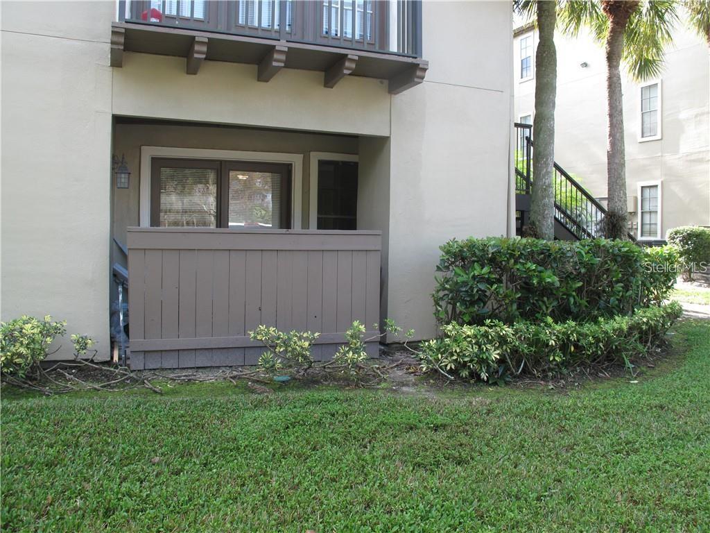 216 Afton Square, Unit 111 Altamonte Springs, FL 32714 - Photo 24 of 41 a house with a yard