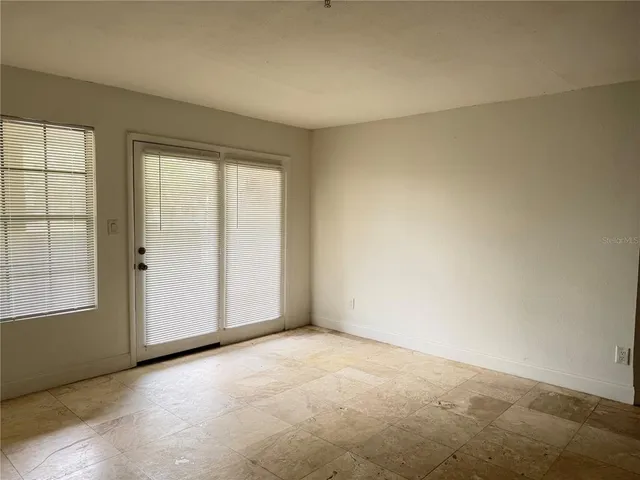 an empty room with windows