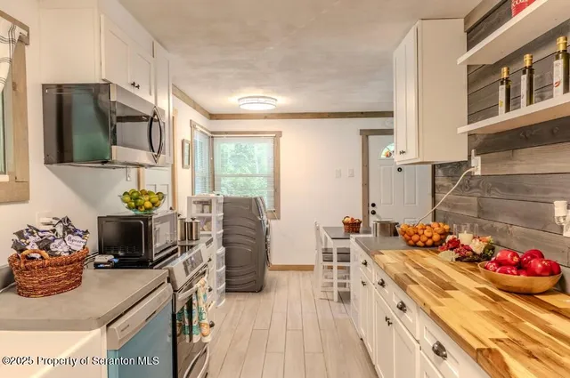 a kitchen with a sink and a window