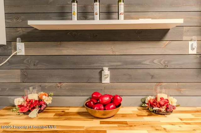 a view of a hallway with wooden floor and a hallway