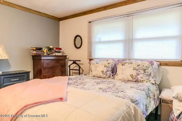 a view of a hallway and filled with furniture