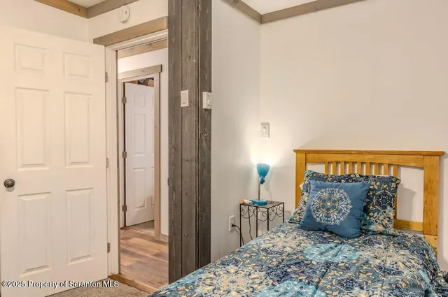 a room with a couch and a lamp