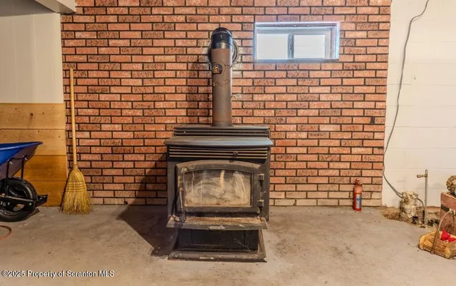 a view of a chair and table in the backyard