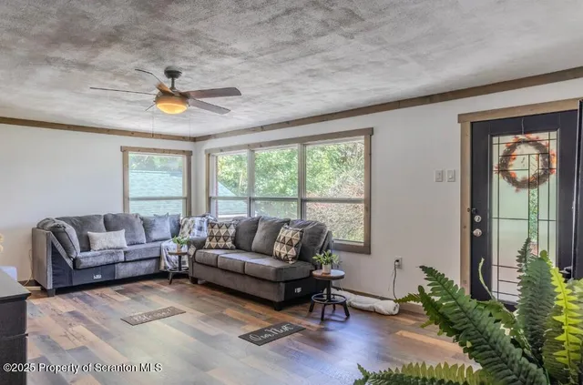 a kitchen with stainless steel appliances a stove top oven a sink a refrigerator and cabinets