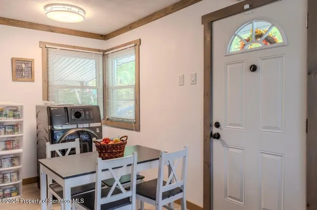 a kitchen with stainless steel appliances kitchen island granite countertop a sink dishwasher stove and refrigerator