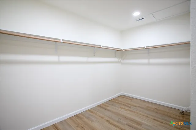 a view of an empty walk in closet