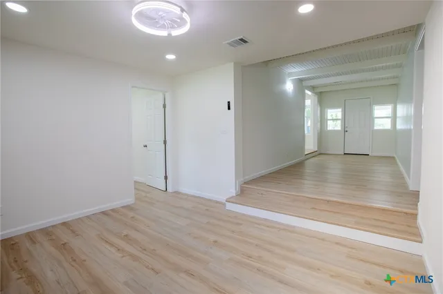 a view of an empty room and window