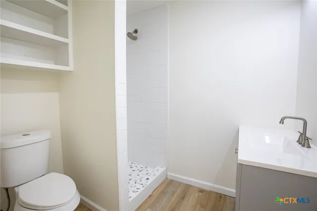 a bathroom with a toilet and a sink