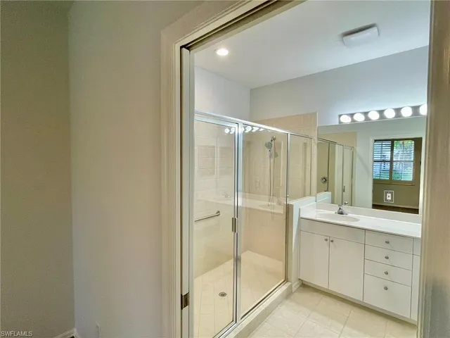 a white toilet sitting next to a shower
