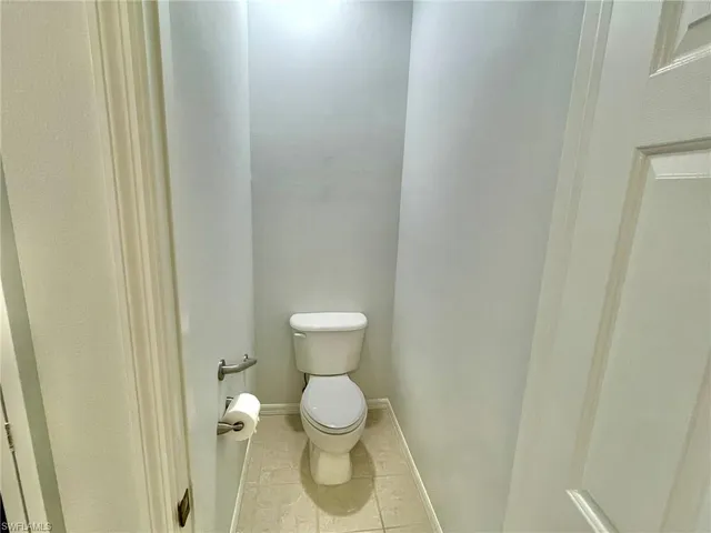 a view of a bedroom with washer and dryer