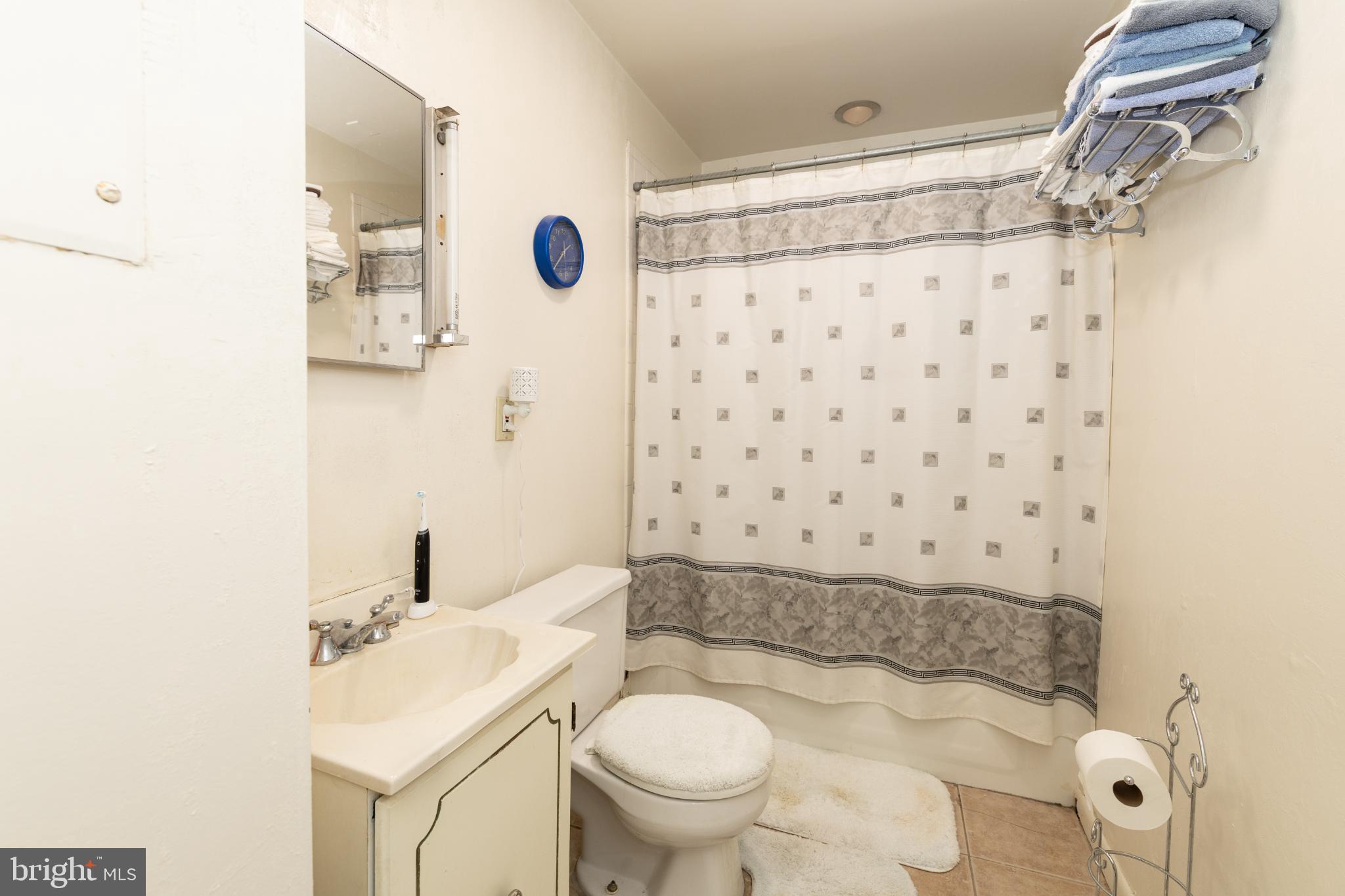 910 Mountain Street Philadelphia, PA 19148 - Photo 22 of 26 a bathroom with a sink toilet and shower