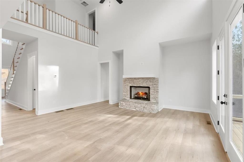 30 Rushden Way Southeast Rome, GA 30161 - Photo 12 of 58 a view of an empty room with wooden floor and a fireplace