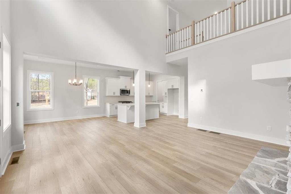 30 Rushden Way Southeast Rome, GA 30161 - Photo 13 of 58 a view of empty room with wooden floor and windows
